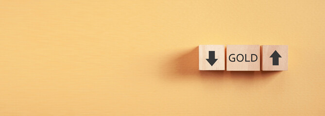 Gold with a up and down arrows. Price of Gold