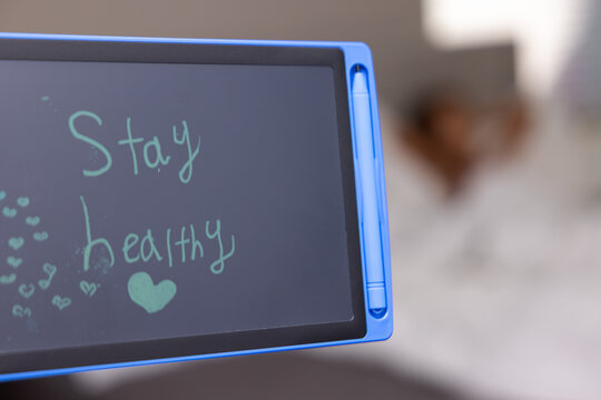 Stay healthy inspiring health message on a small chalkboard.