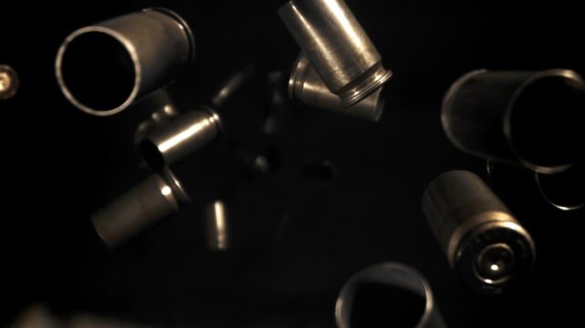 Bullet casings fly up and fall. Filmed on a high-speed camera at 1000 fps. High quality FullHD footage