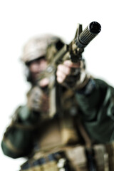 Close-Up View of a Soldier Holding a Rifle in Tactical Gear