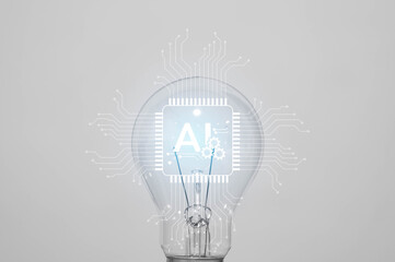 A glowing lightbulb with AI circuit symbolizing artificial intelligence, machine learning, innovation, and smart technology.
