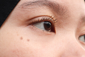 Obraz premium Macro photo of the right eye of a young Asian woman.