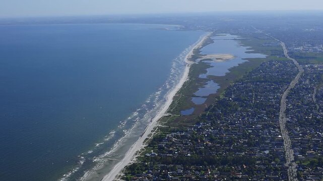 Aerial image of coastline and farm land in rural Denmark.