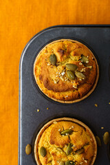 pumpkin muffins on an orange tablecloth