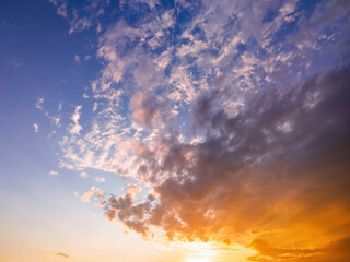 Sunset or sunrise sky with dramatic, colorful clouds. Natural background for concepts of weather, climate, and nature.