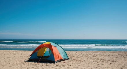 Colorful tent on a sandy beach, bright blue sky