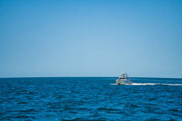 Obraz premium Sporty white yachts on the blue water of the sea. Travel concept