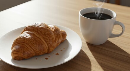 Freshly baked croissant and hot coffee on a wooden table.