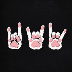 Creative artwork showing three playful paws making rock hand signs