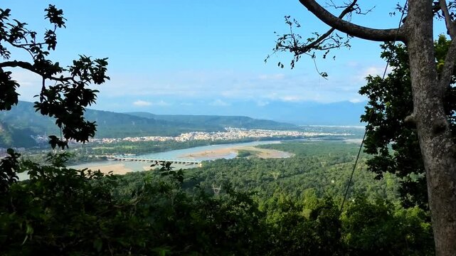 Haridwar cityscape seen from the premises of Chandi Devi Temple, Haridwar, Uttarakhand, India | The river Ganges (Ganga) is also seen
