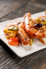 Frying shrimp with vegetables on a grill. Shrimp. Chinese cuisine. Asian food. Food concept.