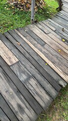 Old wooden walkway, wooden planks laid horizontally.
