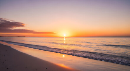 Vibrant Sunrise over Calm Ocean Beach with Soft Waves and Reflective Sky
