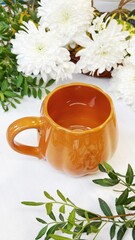 Autumn Composition with Pumpkin-Shaped Mug and Decorative Gourds