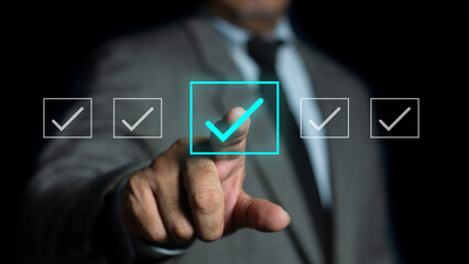 Businessman ticking checkmark on virtual screen. Checking marks on checklist and filling online form, answer questions of test. Audit Document concept, quality assessment, business concept