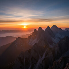 Dramatic Mountain Peaks Illuminated by Golden Hour Sun at Sunrise