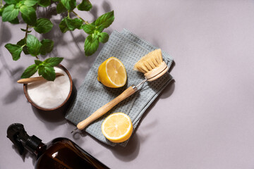 Zero waste cleaning concept with eco brushes and natural sponges on gray background, minimalist top view for sustainable lifestyle and home care design