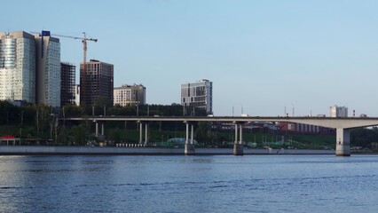 Cityscape with bridge and buildings under construction. Clip