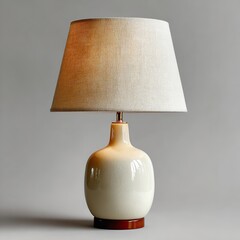 Elegant table lamp casting a warm glow on a gray background