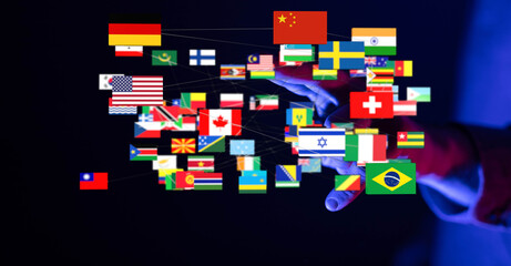 Conceptual image of a global network. Hand connecting flags of different countries, representing international business, technology and teamwork