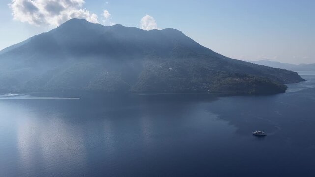 Morning light shines on the volcanic island of Pulau Pura in the middle of Pantar Strait, near Alor, Indonesia. This scenic region of the Lesser Sunda Islands harbors incredible marine biodiversity.