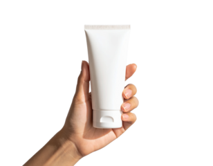 Hand holding a white tube of cream isolated on transparent background