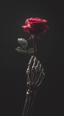 A skeletal hand delicately holds a single, dark red rose against a moody, charcoal-grey backdrop. The image evokes a sense of somber beauty and macabre elegance