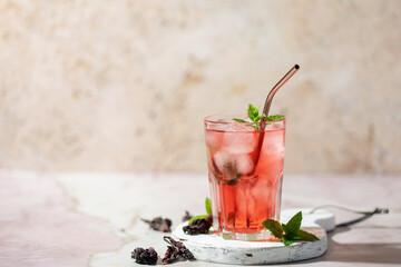 Hibiscus iced tea. Agua de Jamaica or roselle mocktail drink, summer beverage