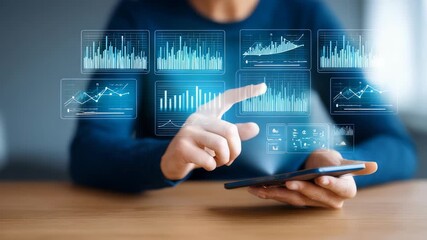 Business professional using a smartphone to analyze futuristic digital data charts and financial graphs. Modern technology and innovation drive real time analytics and smart decision making in finance - Powered by Adobe
