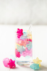 Frozen silicone ice cools the soda in the glass. Summer beverage concept