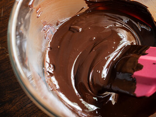 texture of melted dark chocolate in glass bowl