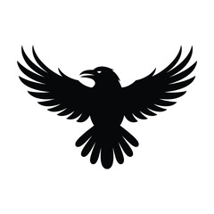 Fototapeta premium Silhouette of a black raven with wings spread wide in flight