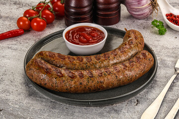 Grilled beef sausages with sauce