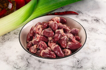 Raw chicken hearts in the bowl