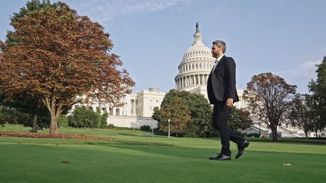 Successful politician in USA. Leadership and success. Successful political leader. Businessman pass US Capitol. Businessman in Washington DC. Politician at Capitol. Man in suit. Political leader