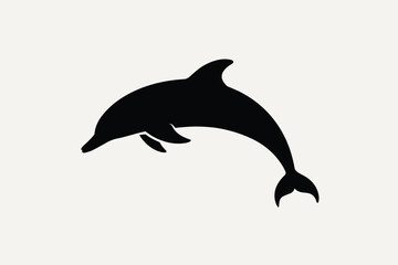 Black silhouette of a dolphin leaping out of the water