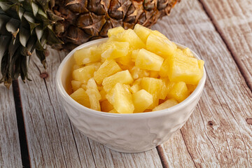 Sweet canned pineapple fruit pieces