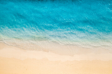 Stunning aerial top view summer sandy beach pristine crystal clear sea water golden sand vibrant coastal vibes perfect for travel vacation nature photography calm waves amazing landscape wallpaper