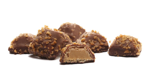Caramel wafers filled with cream , covered milk chocolate with caramel flakes isolated on white background, side view