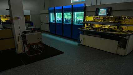 Factory interior showing modern industrial machinery processing materials in an automated setting
