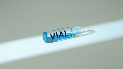 Medicine Vial Blue Liquid on White