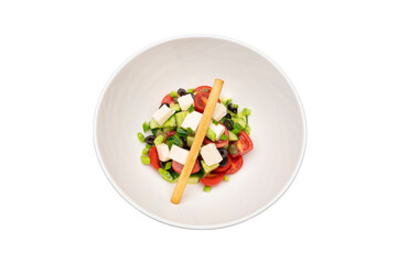 Top-down transparent PNG of colorful Greek salad in a white bowl, perfect for healthy food and menu designs.