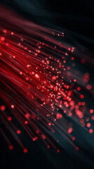 Fototapeta premium Red optical fibers glowing in the dark, symbolizing high-speed internet, data transfer, and modern network infrastructure, representing innovation, connectivity, and digital communication. 