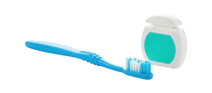 A blue toothbrush and dental floss dispenser rest on a dark background.