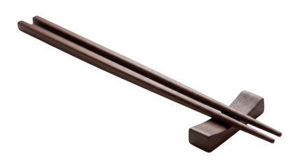 Dark wood chopsticks rest on a small wooden chopstick holder.