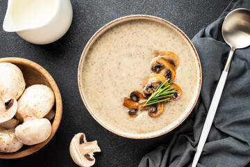 Mushroom soup puree on white kitchen table.