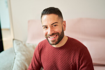 Happy man with beard smiling looking at camera