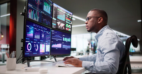 African Business Analyst Analyzing Data