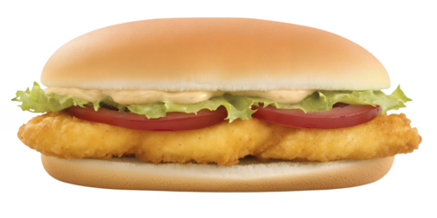 Crispy chicken fillet sandwich with lettuce tomato slices and creamy sauce on a bun