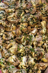 Delicious fresh cooked street food on daily food market in Palermo, Sicily, travel destination, food tourism Italy, variety of roasted, grilled fish, seafood, meat, vegetables served snacks, dish
